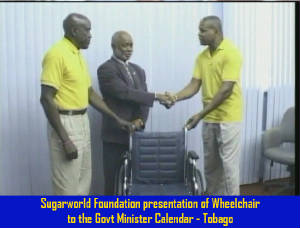 Sugarworld_presentation_of_Wheelchair_to_Govt_Minister_Calendar_Tobago.jpg.w300h228